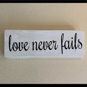 “Love Never Fails” Wooden Decor Sign